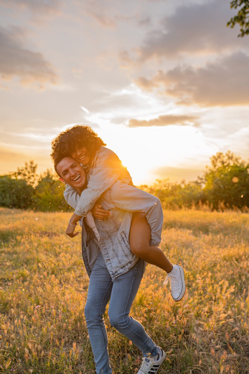 smiling couple having fun in meadow